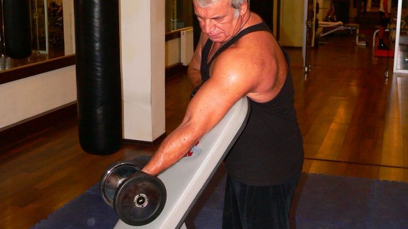Standing One Arm Dumbbell Curl Over Incline Bench